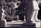 This is a black and white photo in a courtyard of stone statues along Boat House Row in Philadelphia, PA.