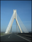 This is a color photo of an artistic bridge driving to northern Ireland to Belfast.