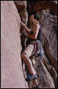 This is a super-imposed photo of my dad climbing a sheer rock cliff.